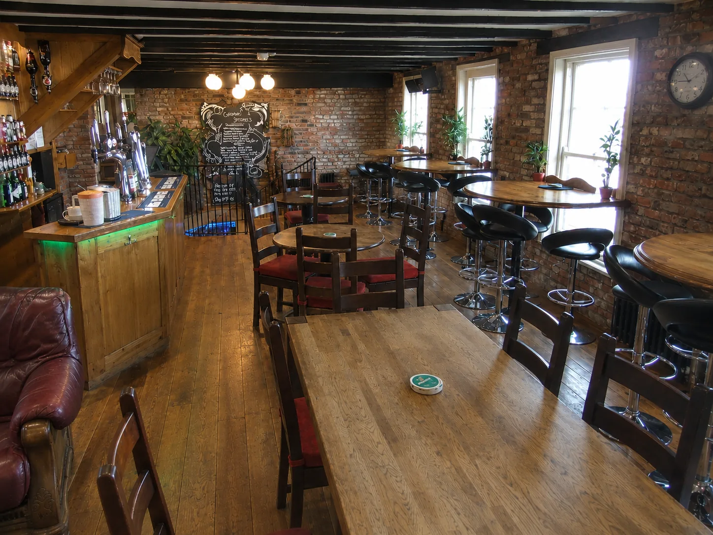 Upstairs bar area with wooden tables